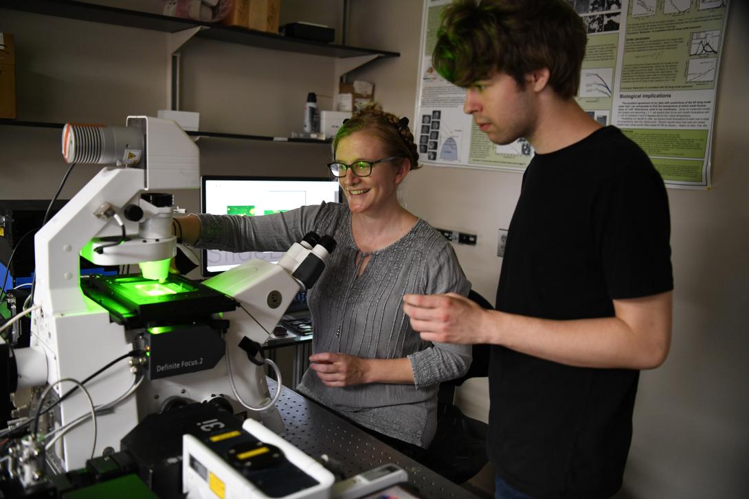 Prof. Honerkamp-Smith (left) leads research in biophysics and is currently studying the physical principles underlying the response of living cells to liquid flow